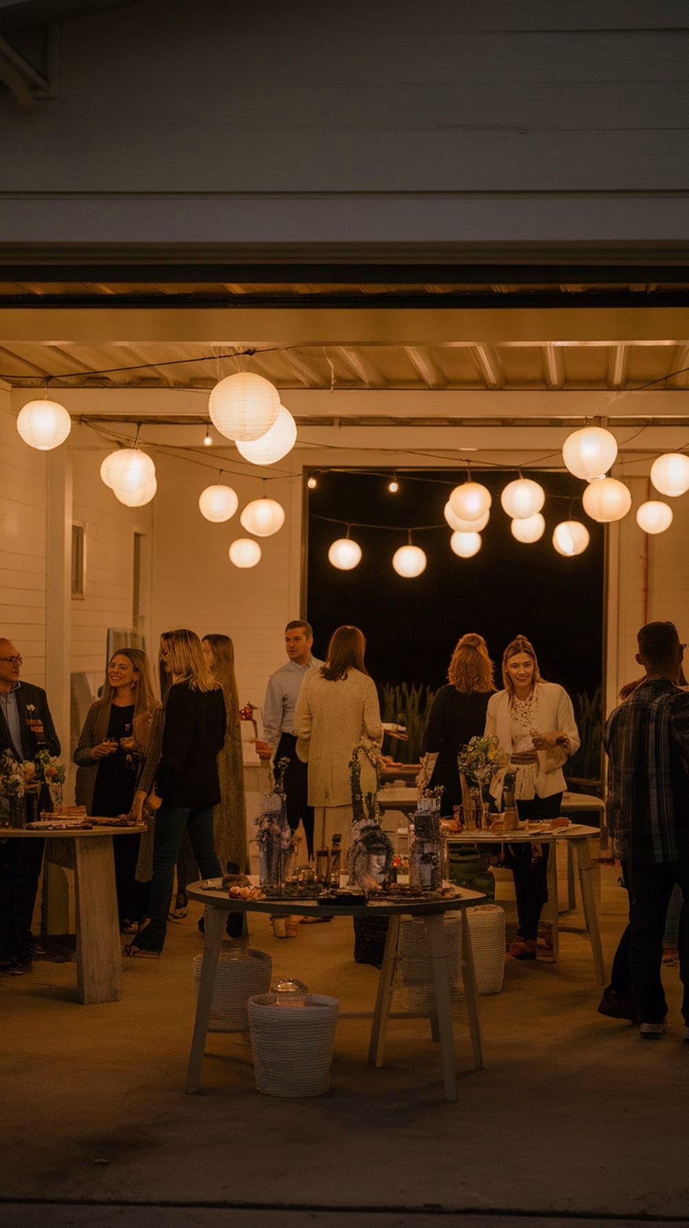 A garage decorated with glowing lanterns for a party