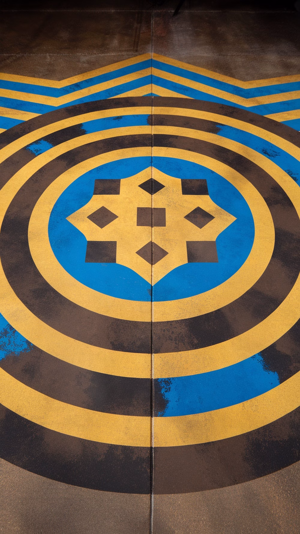 Colorful stained concrete floor with geometric patterns in a garage